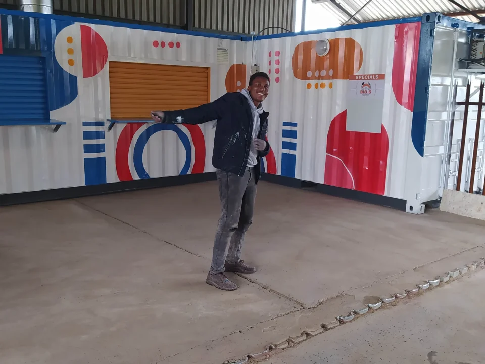 Amecc Malapane at the finished mural