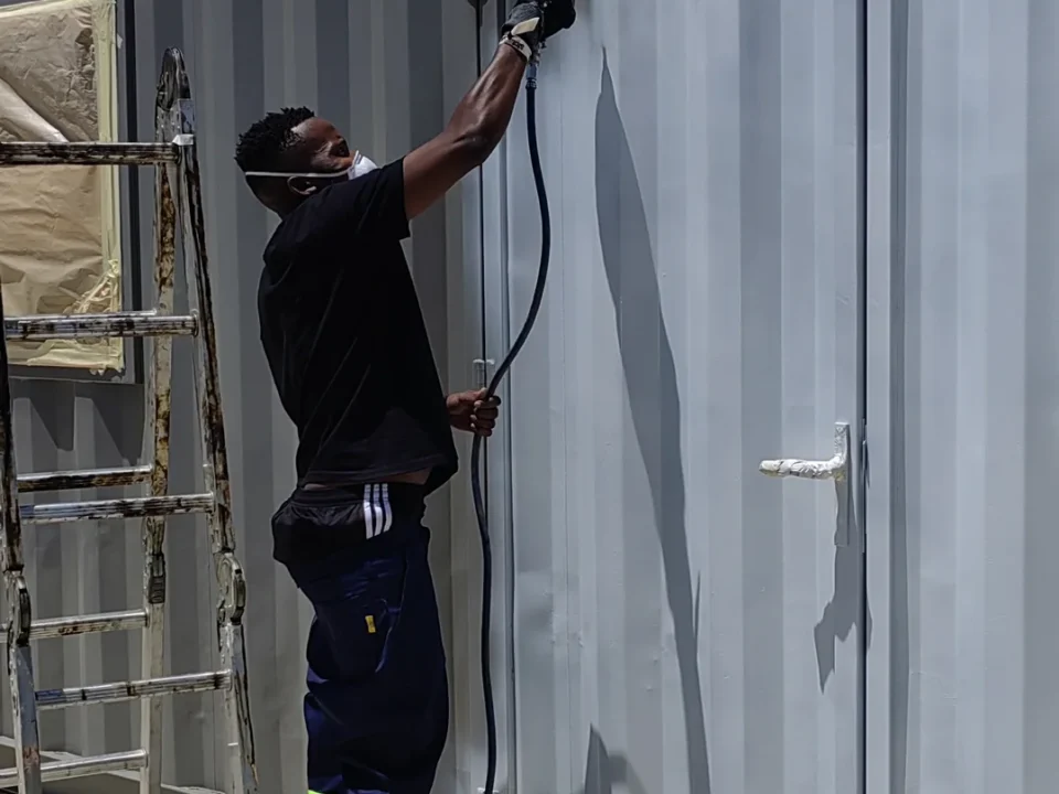 Spraying the first container white