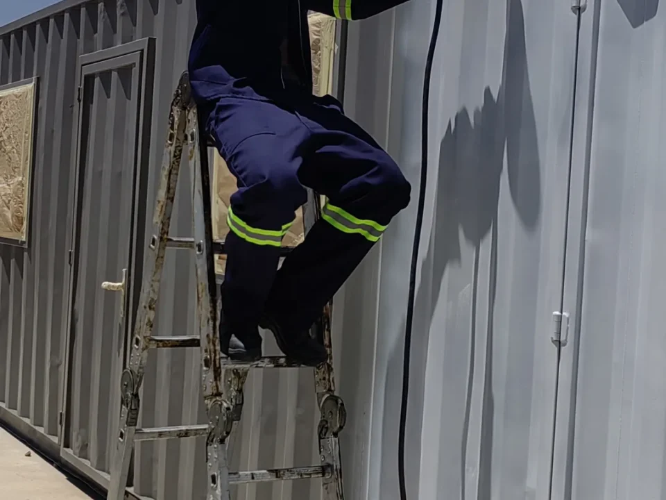 Up the ladder with the spray gun